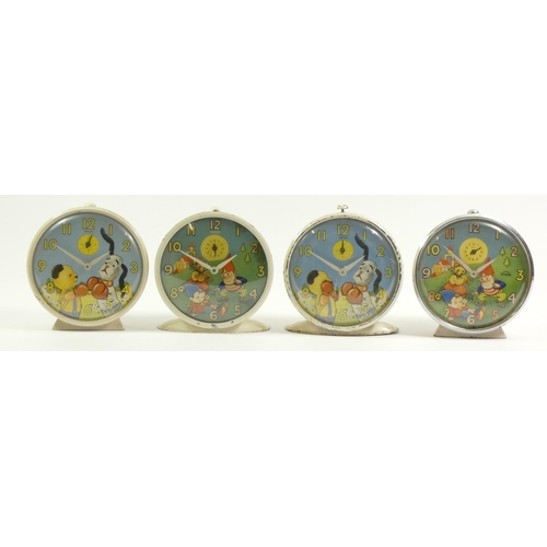 120 - Four Smith's character wind alarm clocks, including two depicted Noddy being woken with automated no... 