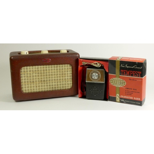 131 - A Roberts Type R55 portable radio, covered in a red leatherette with enamel badge, hinged rear door ... 