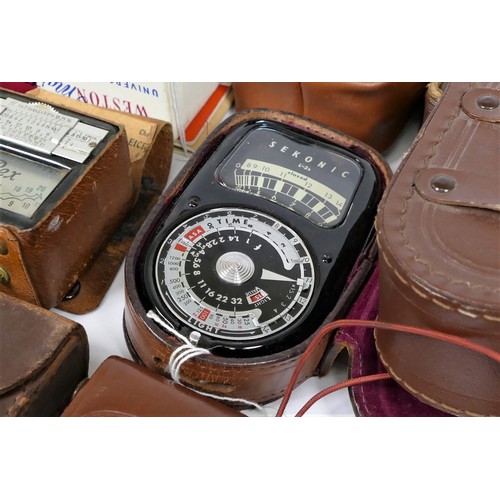 133 - A collection of light meters and flashes, to including brands such as Weston, Agfa, Ikophot and othe... 