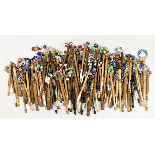 146 - A collection of 131 mainly fruit and hardwood turned bobbins, with spangles, many commemorative, c.1... 