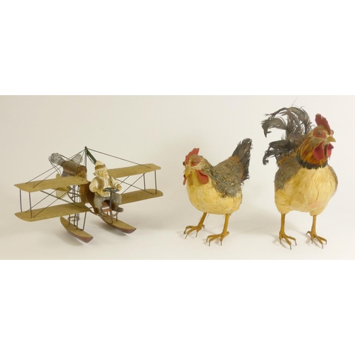 165 - Three models in the form of a Cockerel, Chicken and Pilot, cockerel and chicken feathers attached to... 