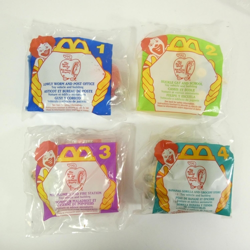 174 - A collection of 60 McDonalds USA Happy Meal toys, complete sets, original packaging, to include fran... 