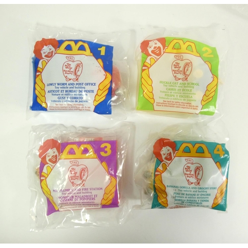 175 - A collection of 60 McDonalds USA Happy Meal toys, complete sets, original packaging, to include fran... 