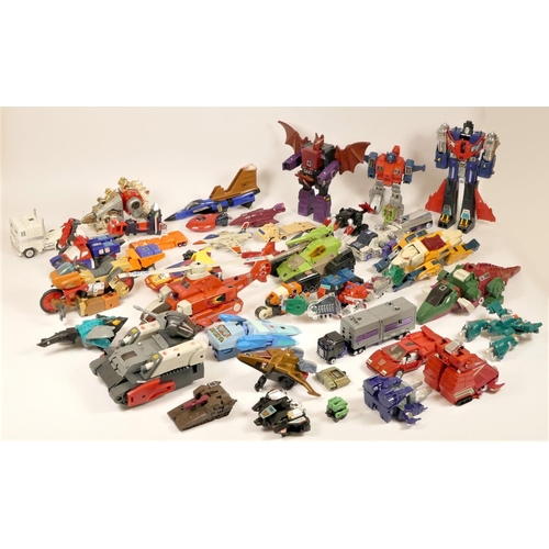 180 - A collection of over 35 Transformers and transforming toys