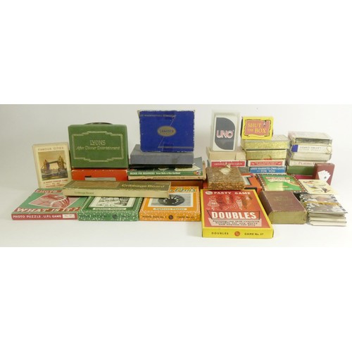 189 - A collection of over 30 card games, marbles and other table top games, includes brands such as Waddi... 