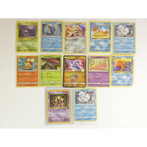 202 - A collection of twelve Pokémon cards, all in plastic covers, to include : 

Vulpix (Toys R Us) x 2
S... 