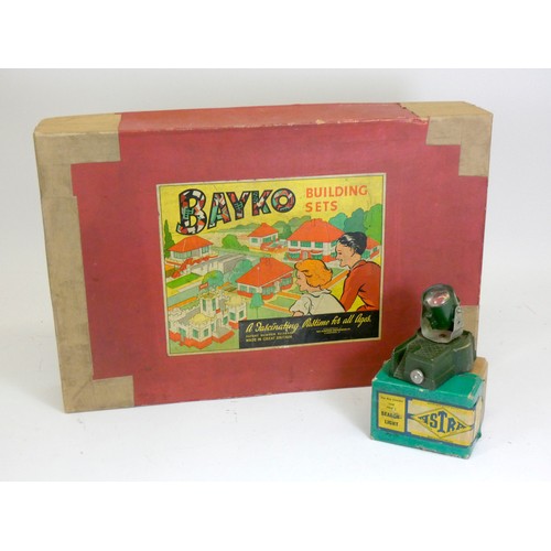 208 - A Bayko building set, No. 4, original box, together with a Astra Searchlight (2)