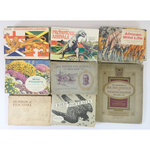 225 - A collection of sixty card companion albums, including albums from Players, Brooke Bond and W.D. & H... 