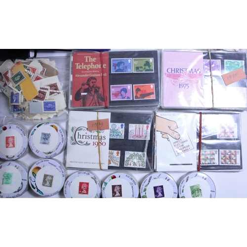 233 - A large collection of stamps to include 1970/80's presentation packs, several tins of used GB, three... 