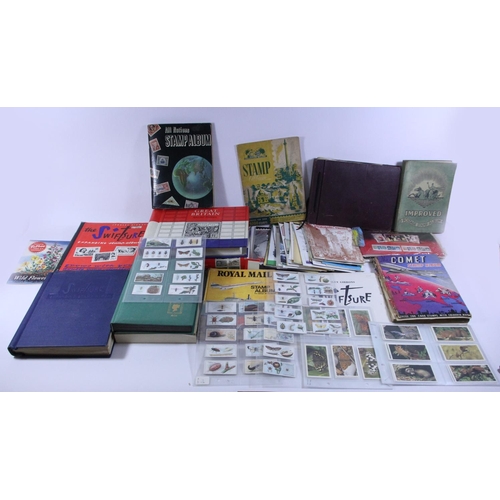 234 - A large collection of stamps, to include an album of mint 1924 - 1979, partially full, two albums of... 