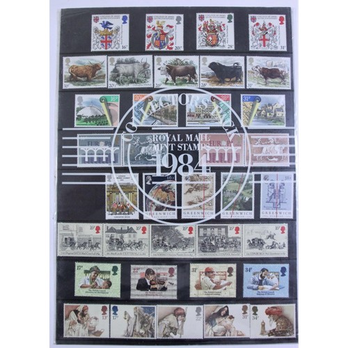 235 - A large collection of stamps to include year packs from 1984 - 2011, several school boy albums, over... 