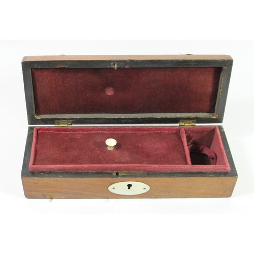 239 - A mahogany and ivorine mounted domed pistol box, opening to reveal a fitted interior, 26 x 9 x 7cm