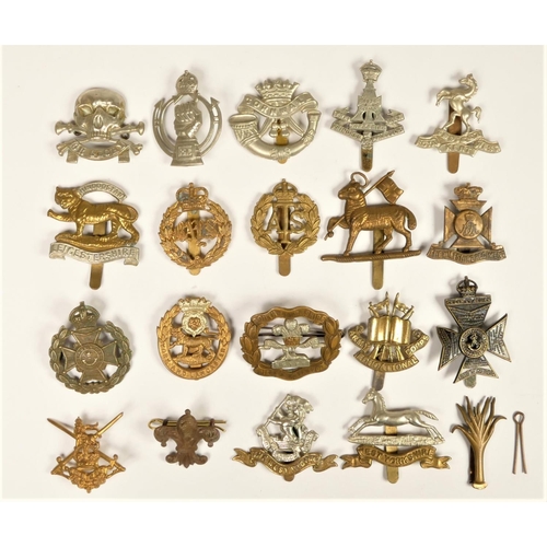 256 - A collection of 20 military cap badges, to include West Yorkshire, West Riding, RAC and Royal West K... 