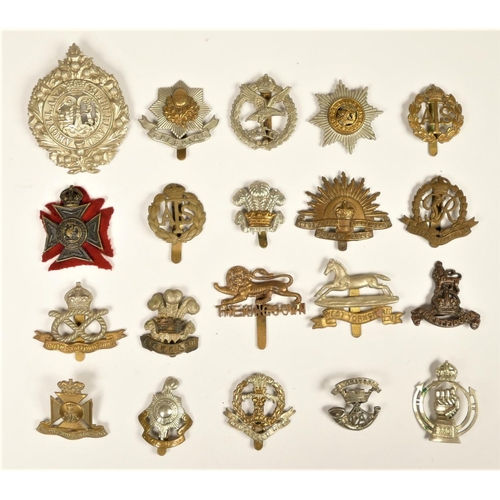 258 - A collection of 22 military cap badges, to include Royal Armoured Corps, Cheshire and South Staffs