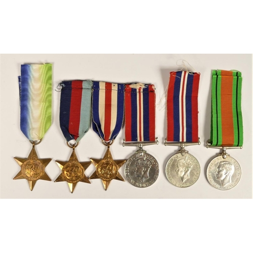 262 - A group of six WWII medals, to include Atlantic Star, Defence and War and a mounted group of 1939-19... 