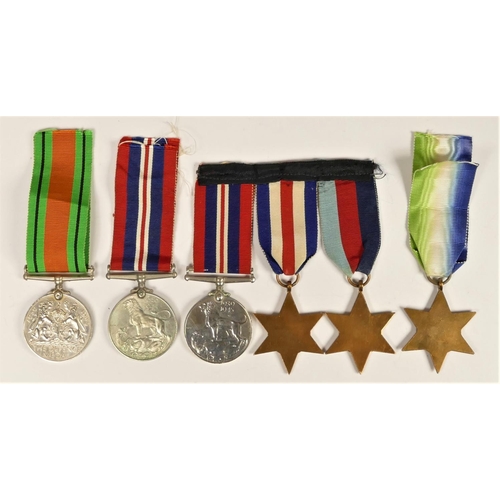 262 - A group of six WWII medals, to include Atlantic Star, Defence and War and a mounted group of 1939-19... 