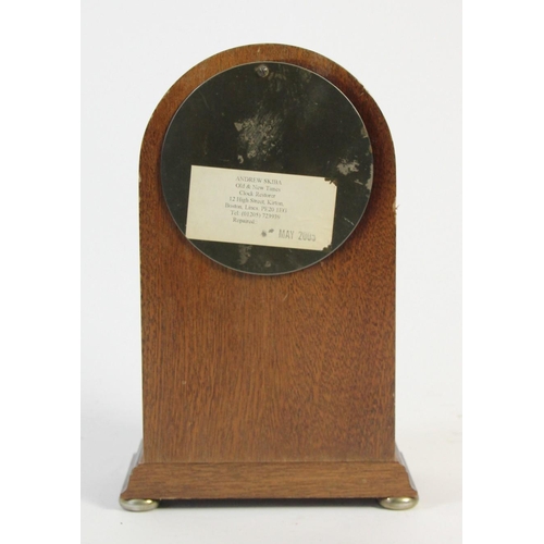 A Knights & Gibbins, London, a mahogany mantle clock, the white
