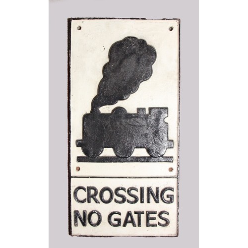 130 - A replica cast iron 'Crossing No Gates' sign, 58 x 29 cm