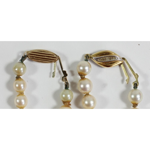 A uniform cultured pearl necklace, 6mm beads, 39cm, 9ct gold clasp and  another with 5mm beads (2)