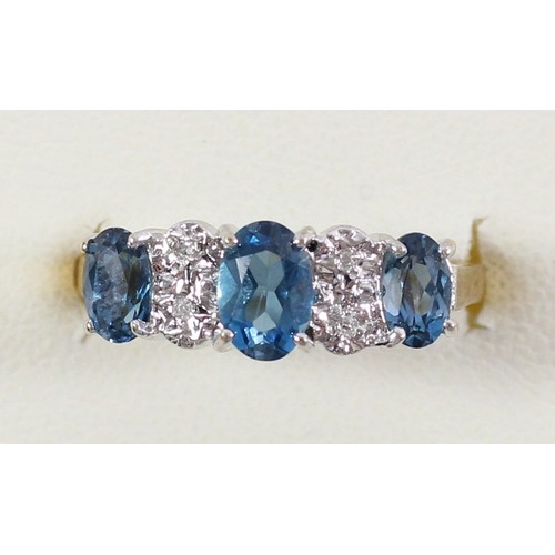 62 - A 9ct gold blue topaz? and diamond ring, L, 2gm