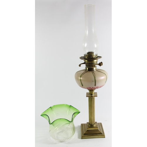 79 - An Art Nouveau glass and brass oil lamp, the iridescent bowl in the manner of Loetz, reeded column t... 