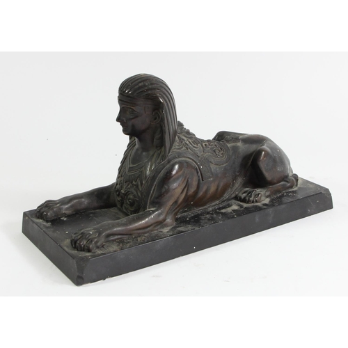 80 - A 19th century French bronze statue of a sphinx, mounted on a black marble base, 26 x 11 x 13cm