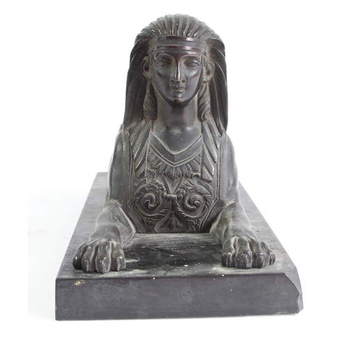 80 - A 19th century French bronze statue of a sphinx, mounted on a black marble base, 26 x 11 x 13cm