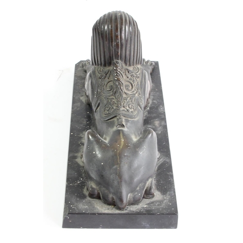 80 - A 19th century French bronze statue of a sphinx, mounted on a black marble base, 26 x 11 x 13cm