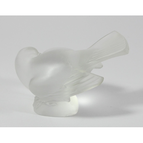 89 - A Lalique frosted glass bird, etched in script 