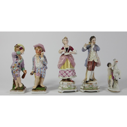 97 - Five continental porcelain figurines to include, a male and female performing, two children and a ma... 