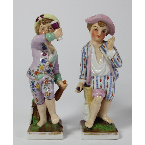 97 - Five continental porcelain figurines to include, a male and female performing, two children and a ma... 