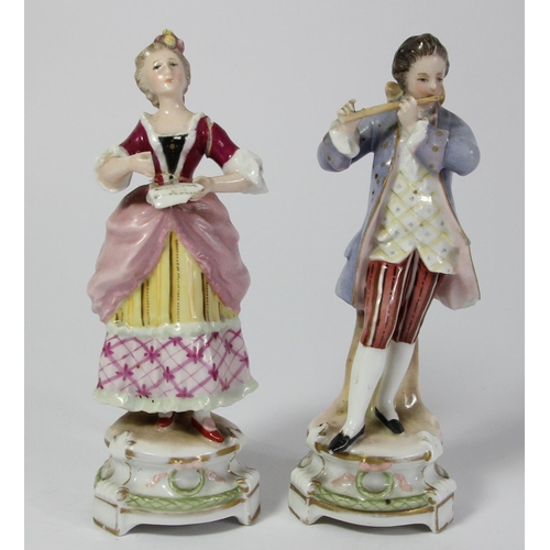 97 - Five continental porcelain figurines to include, a male and female performing, two children and a ma... 