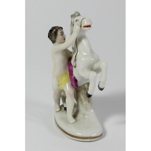 97 - Five continental porcelain figurines to include, a male and female performing, two children and a ma... 