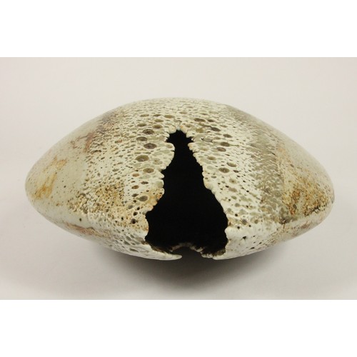 98 - Alan Wallwork (1931- 2019); a stoneware split pebble with impressed decoration around the parting, i... 
