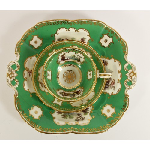 107 - A late 19th century trio, possibly Coalport, decorated with buildings, gilt borders and apple green ... 