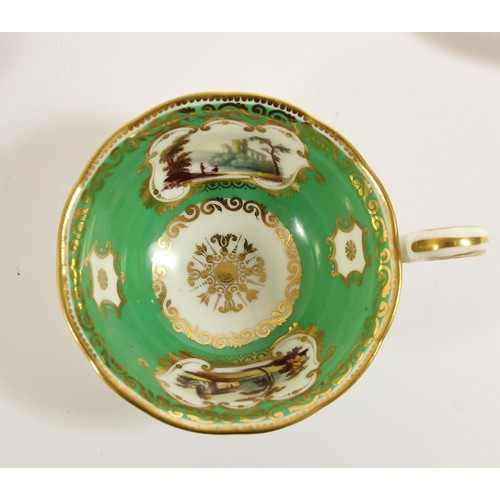 107 - A late 19th century trio, possibly Coalport, decorated with buildings, gilt borders and apple green ... 