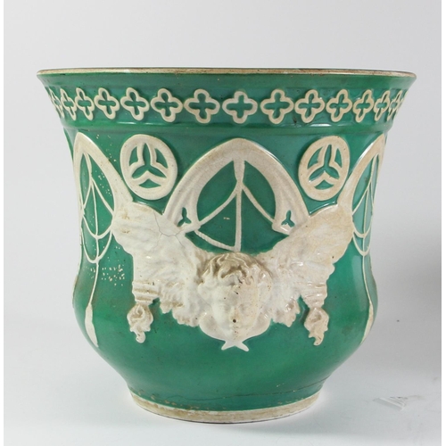 119 - A Puginist Gothic green planter with winged cherub detail, 20 x 22cm, another smaller example, 17 x ... 