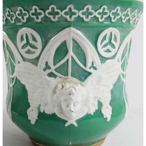 119 - A Puginist Gothic green planter with winged cherub detail, 20 x 22cm, another smaller example, 17 x ... 