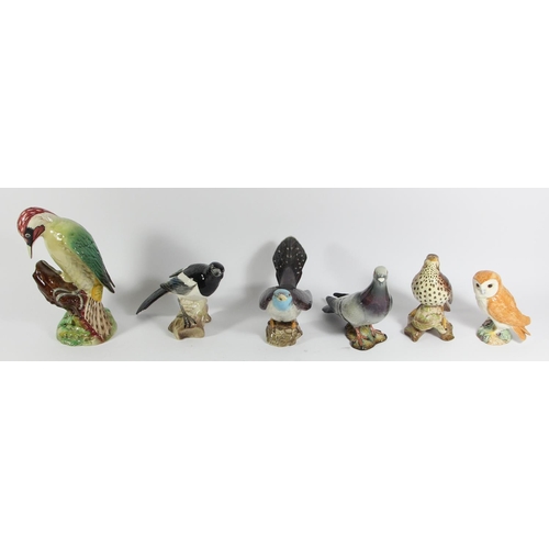 126 - Six Beswick ceramic birds to include, Song thrush (2308) 14cm, Pigeon (1383B) 15cm, Magpie (2305) 13... 