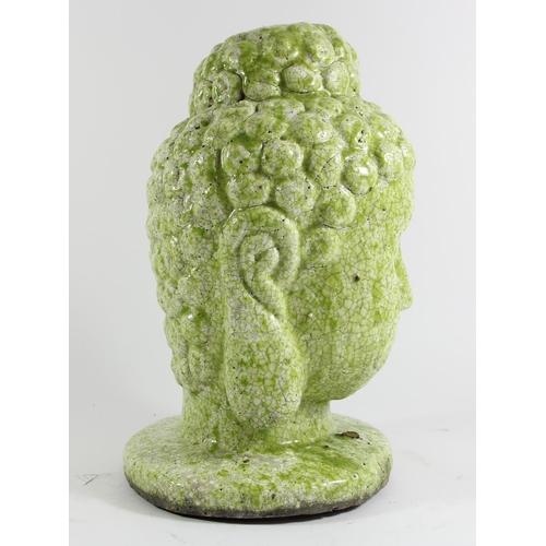 135 - A large hand potted terracotta bust of Buddha, lime green mottled glaze, 34cm