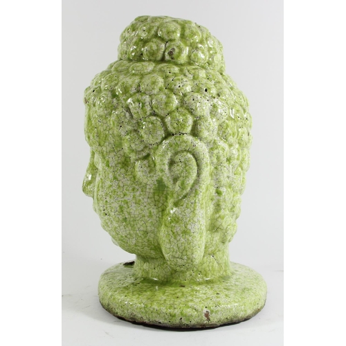 135 - A large hand potted terracotta bust of Buddha, lime green mottled glaze, 34cm