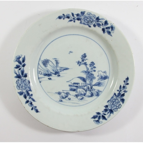 139 - An 18th century Chinese blue and white plate with pagoda decoration, 23cm, another with a rocky land... 