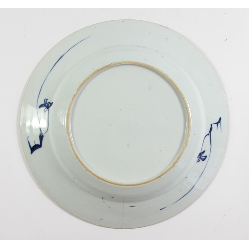 139 - An 18th century Chinese blue and white plate with pagoda decoration, 23cm, another with a rocky land... 