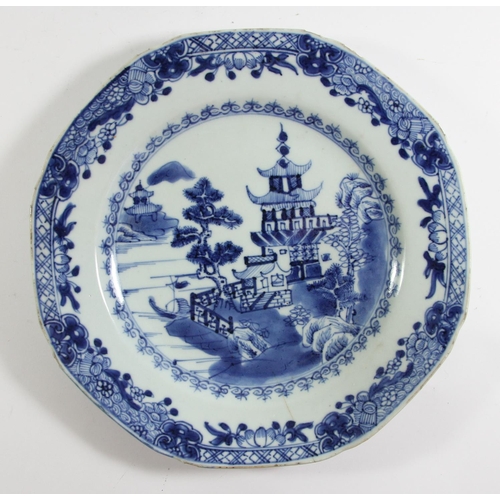 139 - An 18th century Chinese blue and white plate with pagoda decoration, 23cm, another with a rocky land... 