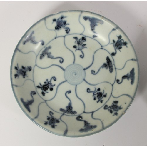 141 - Three Chinese Tek Sing plates, circa 1820s, decorated with blue and white lotus designs, retains Nag... 