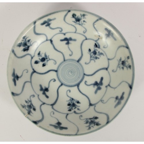 141 - Three Chinese Tek Sing plates, circa 1820s, decorated with blue and white lotus designs, retains Nag... 