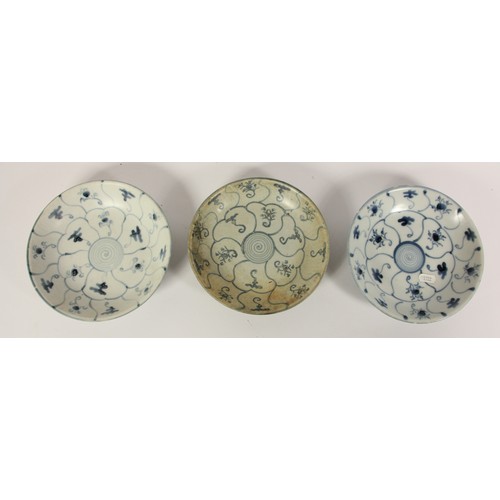 142 - Three Chinese Tek Sing plates, circa 1820s, decorated with blue and white lotus designs, retains Nag... 