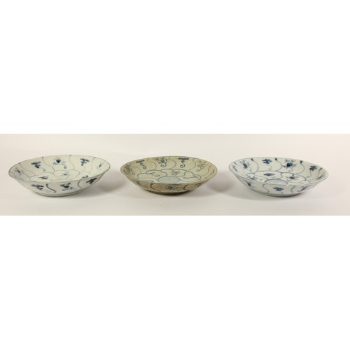 142 - Three Chinese Tek Sing plates, circa 1820s, decorated with blue and white lotus designs, retains Nag... 