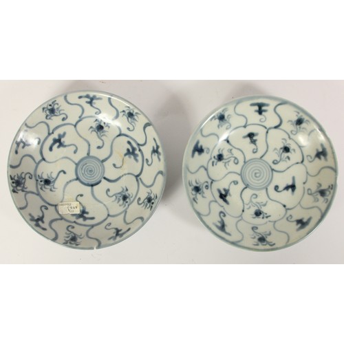 143 - Two Chinese Tek Sing plates, circa 1820s, decorated with blue and white lotus designs, character mar... 