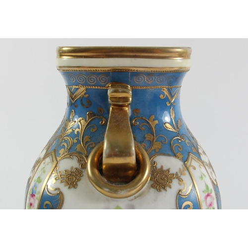 146 - A Japanese pair of Noritake vases, decorated with panels of flowers and gilt on a blue ground, 23cm.